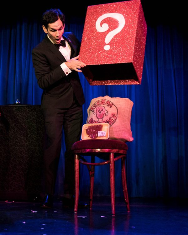 magician doing trick on stage